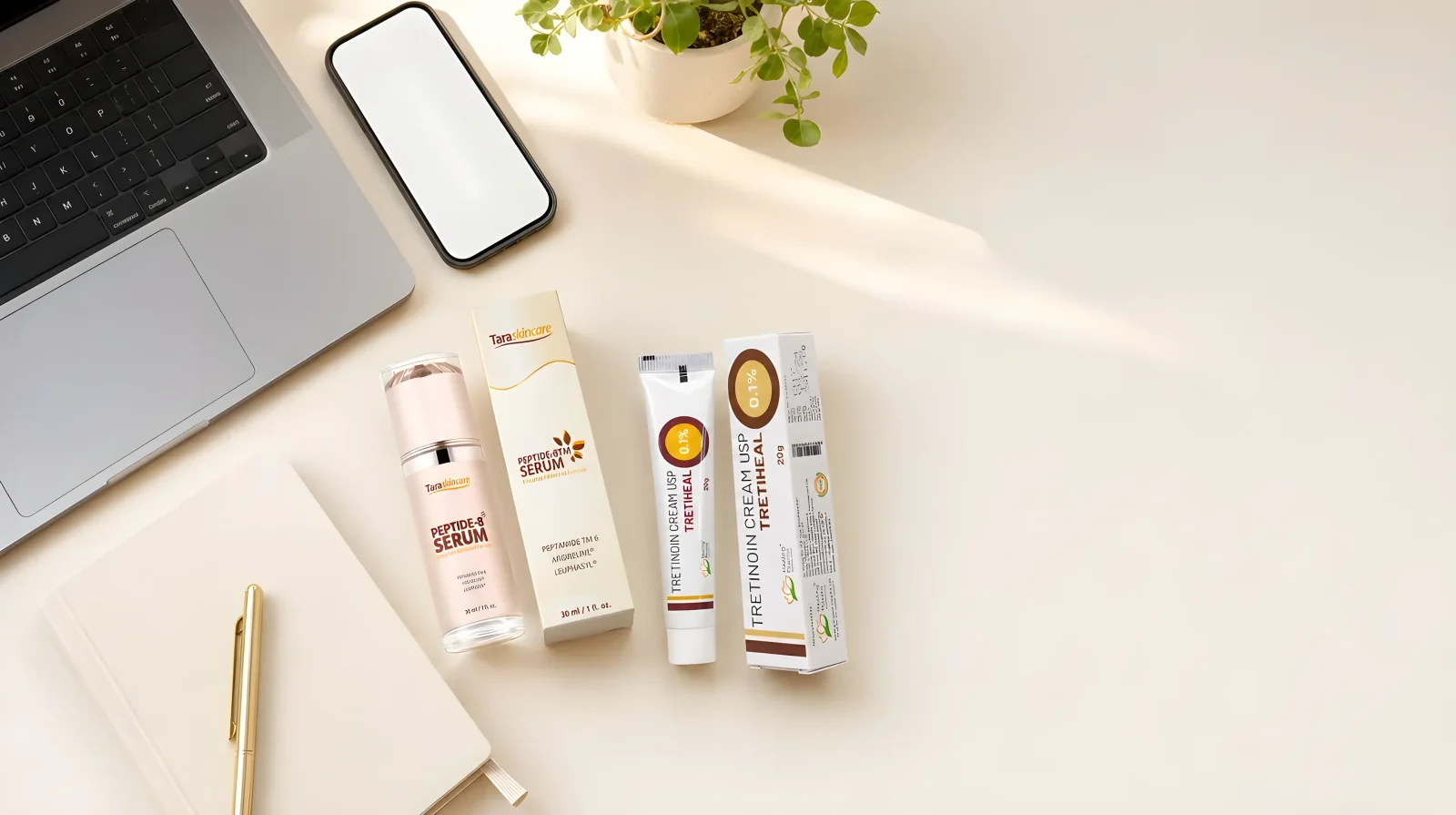 Content-creator desk with laptop, phone and TaraSkinCare products
